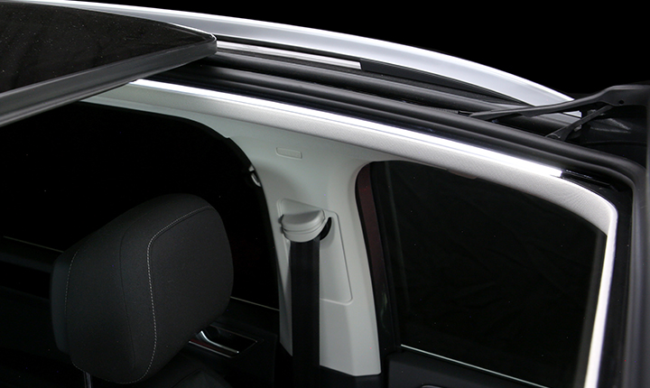 Open panoramic sunroof with white SCHOTT contour lighting