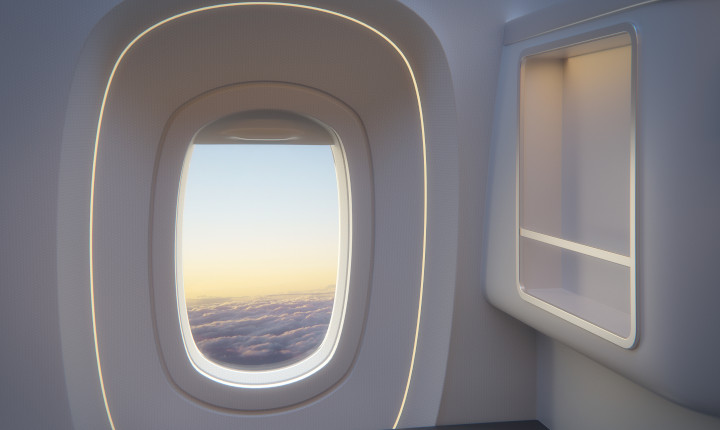 Window portal from the inside of an aircraft with an early morning view