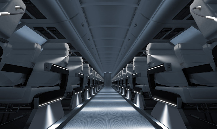 Aisle between seats in an aircraft cabin lit by SCHOTT® HelioBasic II LED light sources