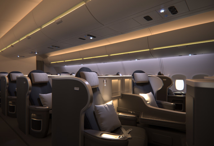 Interior of a businessclass aircraft cabin featuring spotlights and reading lights