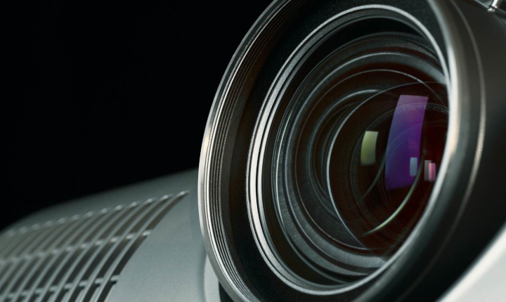Close up of the lens of a digital projection unit