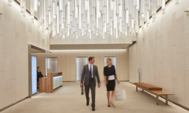 Man and woman walk through the reception area of the 20 Martin Place building in Sydney, Australia, made using CONTURAX® glass rods