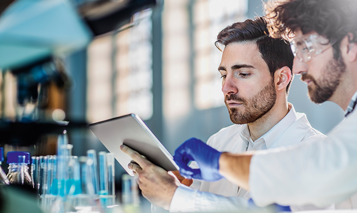 Two young male scientists working in a laboratory