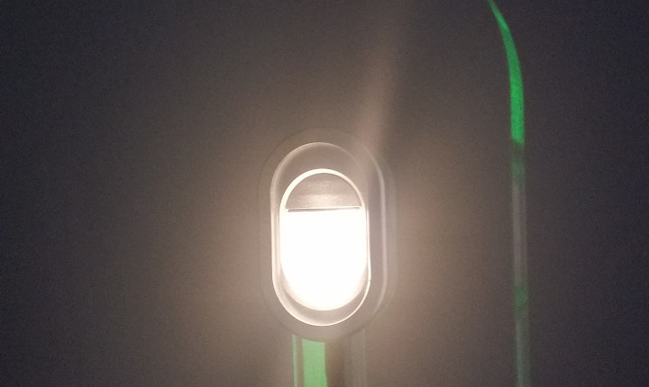 Single white SCHOTT® HelioFlex Spot Light in the ceiling of an aircraft cabin	