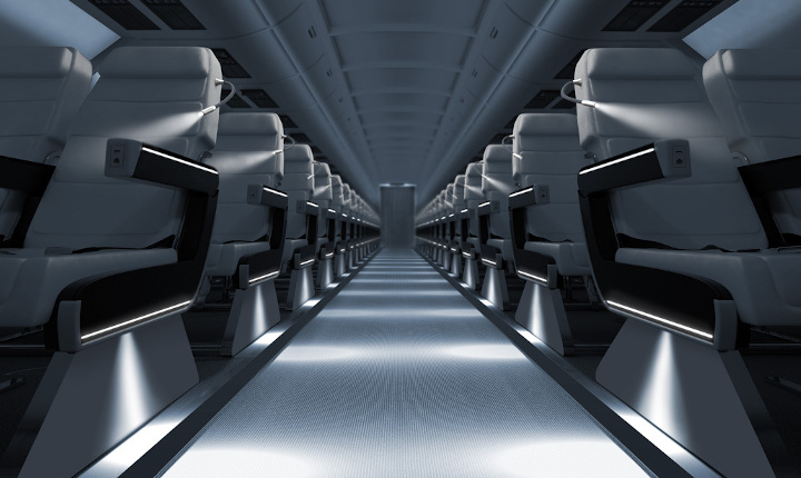 Aisle between seats in an aircraft cabin lit by SCHOTT® HelioFlex Spot Lights	