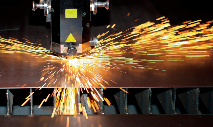 Sparks flying from an industrial laser cutting machine	