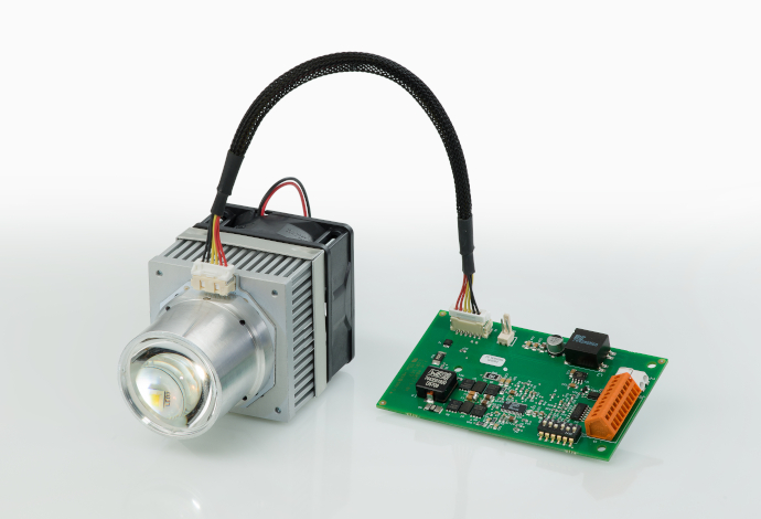 Silver SCHOTT® LED Fiber Lighting Module connected to a green microchip