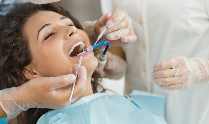 Female patient examined by a dentist	