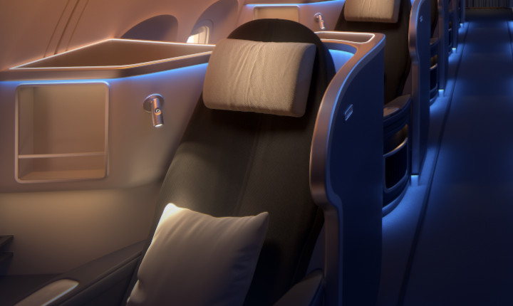 Seating area inside first class area of an aircraft cabin highlighted with blue SCHOTT mood lights