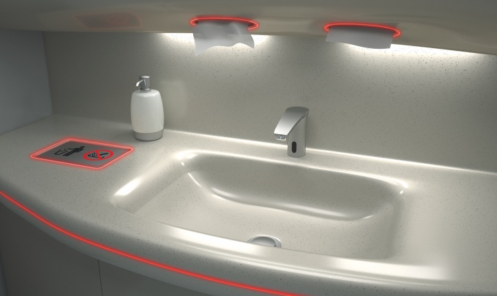 Red SCHOTT mood lights around the features inside an aircraft bathroom