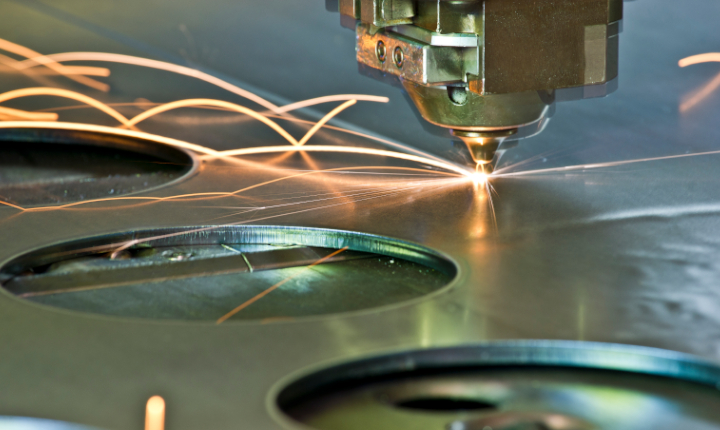 Laser equipment cutting circular shape in metal sheet