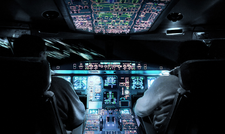 Interior of an aircraft cabin at night with displays using SCHOTT Optical Filter Glass