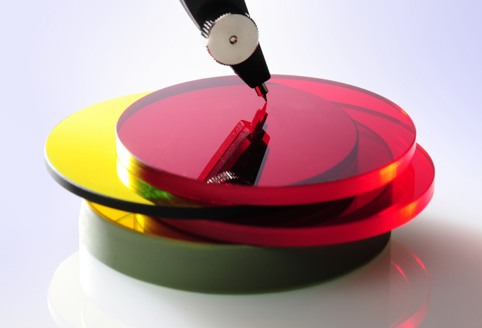 Stack of red and yellow optical filter glass discs