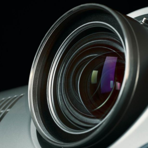 Close up of the glass lens of a digital projector