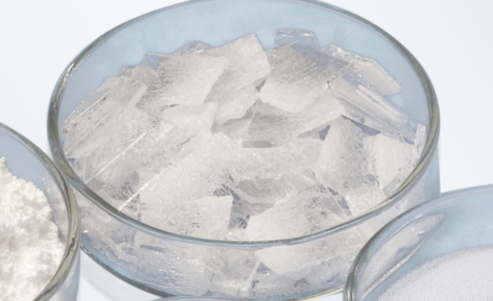 White glass powder in a clear glass dish