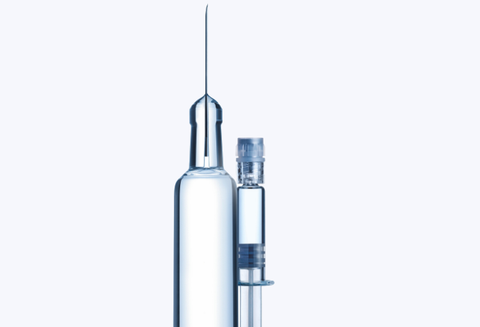 Two clear glass syringes made by SCHOTT