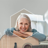 Middle-aged woman leaning on an acoustic guitar