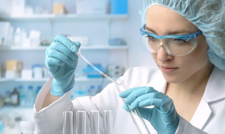Young female scientist performs protein assay in a laboratory