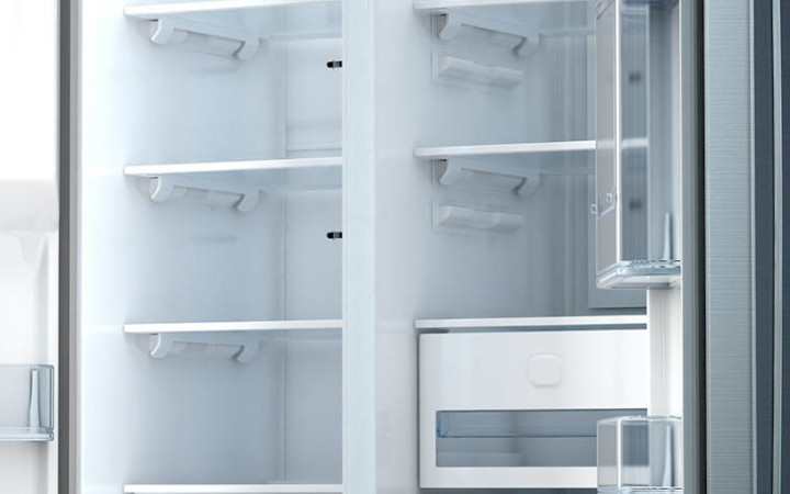 Empty double refrigerator with open doors