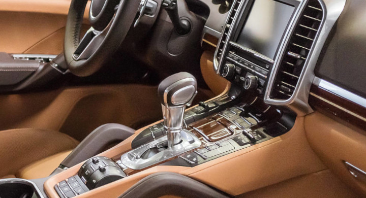 SCHOTT components are present in many sensors and electronics inside modern vehicles Brown interior of a luxury vehicle with dashboard, steering column and gear stick