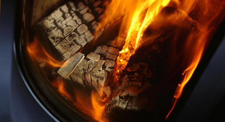 SCHOTT specialty glass and glass-ceramics are idea for fireplaces and heating systems Close up of a burning log fire