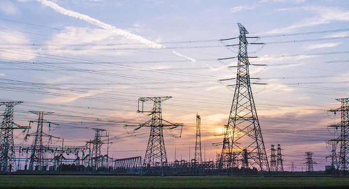 Energy production and transportation systems use a wide range of SCHOTT products Rows of electrical pylons with sunset background