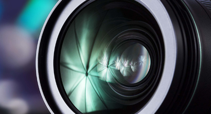 Close up of a camera lens with blurred background