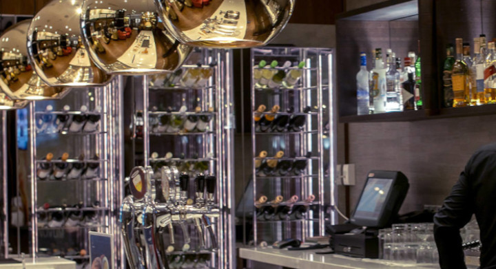 Luxury bar with barman and bottles