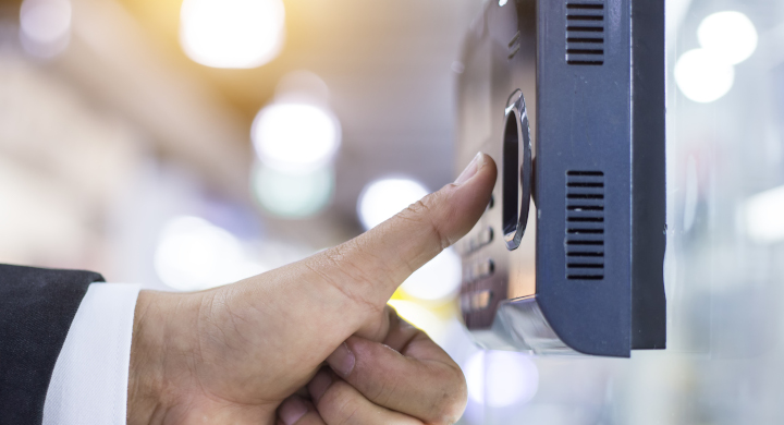 Safety and security systems use a wide range of glass materials and components Thumb poised over a fingerprint touchscreen security system