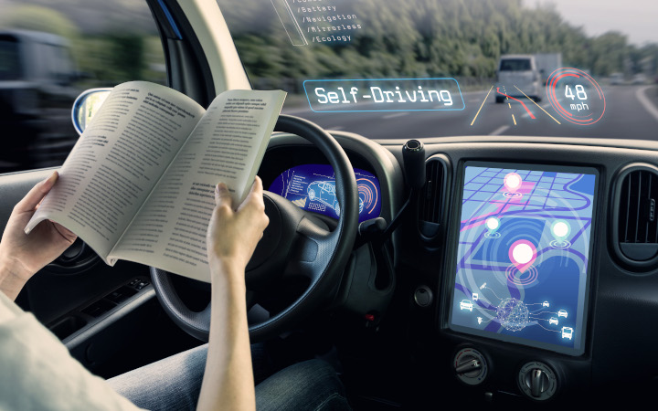 Passenger reading a book in an autonomous vehicle