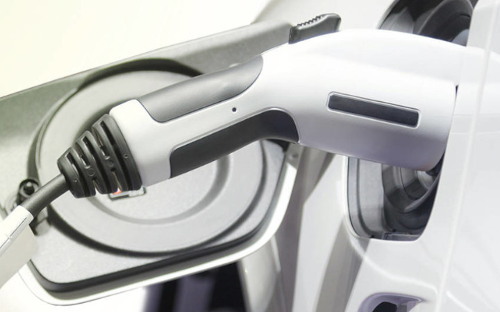 Electric vehicle charger fitted to vehicle input plug	