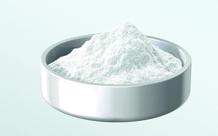 White glass powder in a silver metal dish