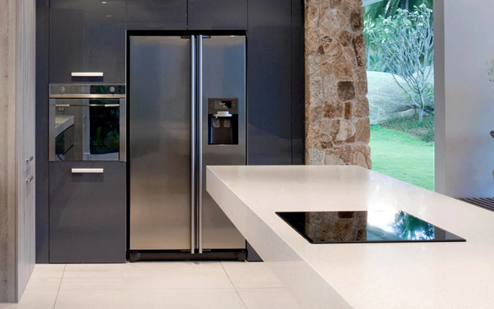 Modern kitchen with a range of appliances looking out onto a garden