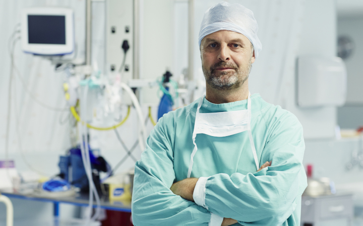 Medical professional in a hospital surrounded by equipment