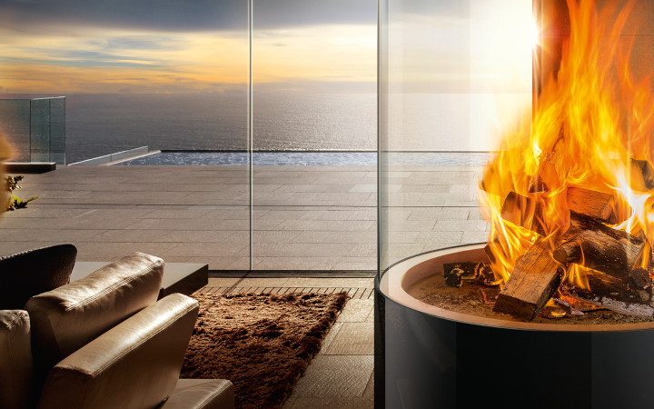 Burning fire in an outdoor log burner encased in glass