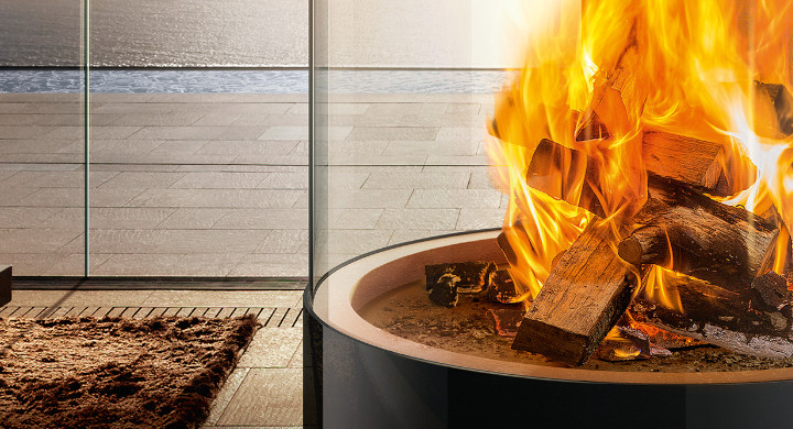 SCHOTT offer a wide range of glass and glass components for the terrace and garden Burning fire in an outdoor log burner encased in glass
