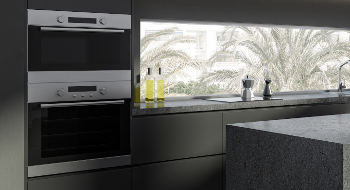 SCHOTT produce a range of glass and glass-ceramic components for the home kitchen Sleek dark modern domestic kitchen with a range of appliances