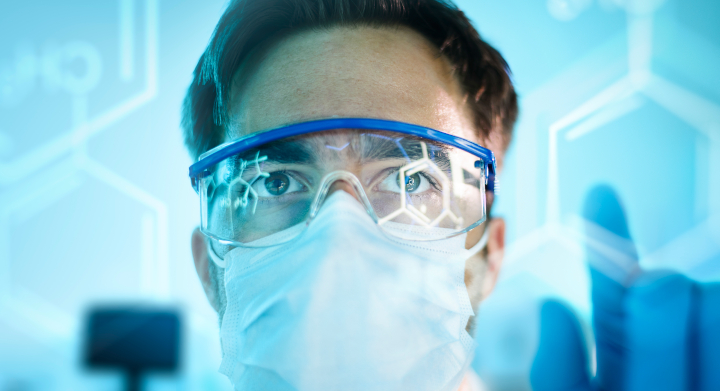 SCHOTT manufactures a vast range of products for the health industry Male doctor in safety glasses looking forwards