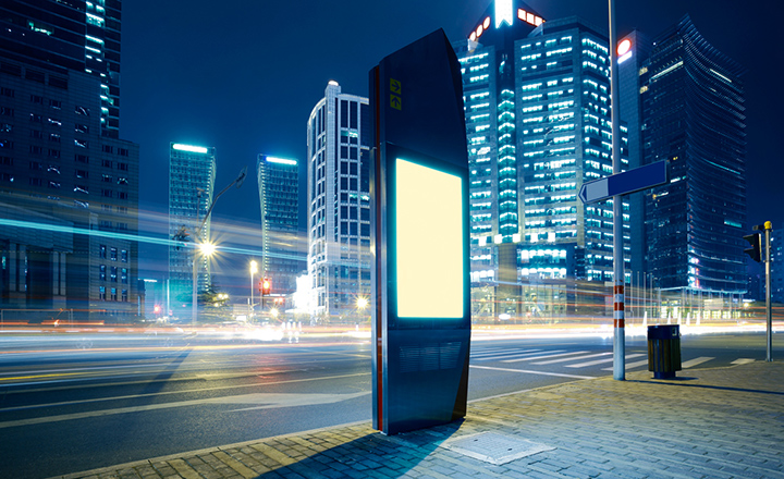 Empty city road with an outdoor digital display 